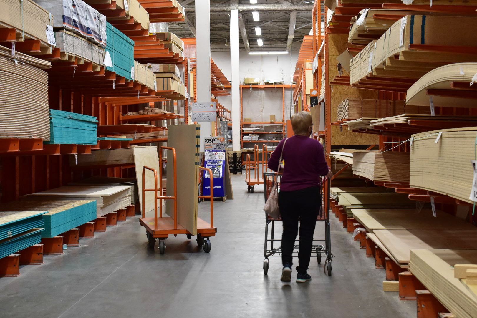 Jean McCawley browses the wood department of Home Depot, searching for plywood to create her Halloween and Christmas decorations. McCawley is known for her drawings and decorations she makes for friends, family, parties and holidays. Westminster, Colo., Nov. 13, 2020. (Kerry McCawley/MSU Denver)