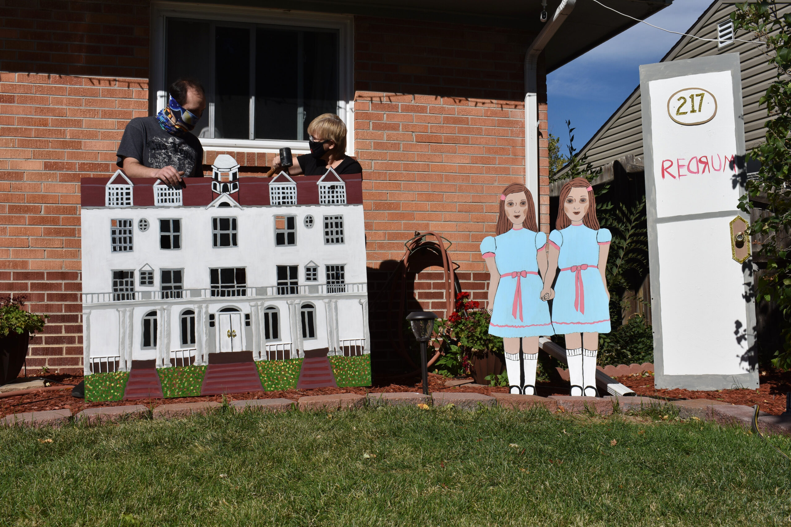 McCawley and Caudill set-up the finished replica of the Stanley Hotel, in preparation for Halloween. Westminster, Colo., Oct. 12, 2020. (Kerry McCawley/MSU Denver)